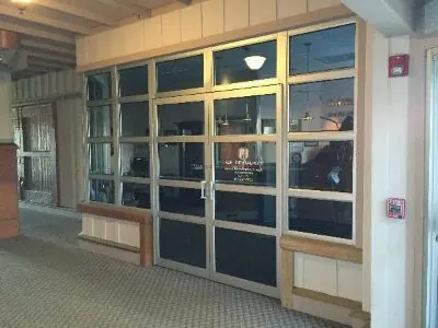 The glass doors of Suite 101, the A.I.R. Dentalplex entrance inside the Gristmill.