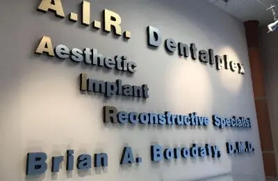 The wall inside Suite 101 reading A.I.R. Dentalplex, Aesthetic, Implant, Reconstructive Specialist, Brian A. Borodaty, D.M.D.